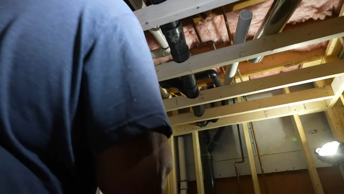 Exposed interior plumbing and pipe repair area showing copper detail for residential community in Buckeye, AZ
