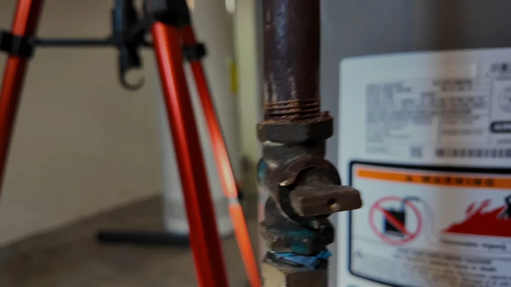 Water heater tank, piping, and service components used during water heater installation work near Buckeye, AZ