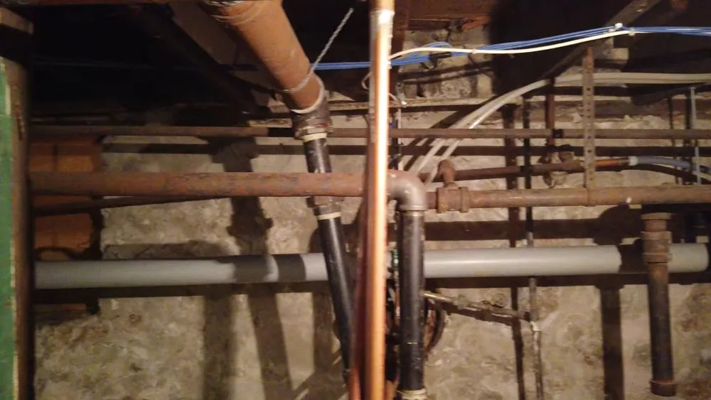 Drain cleaning tool working through a clogged line for general in Buckeye Valley